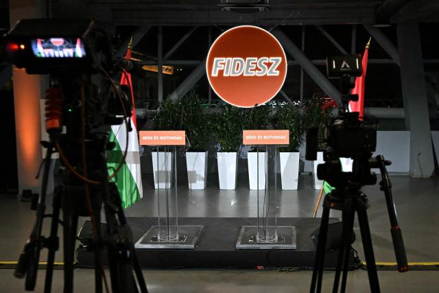 Cameras and a podium are pictured at the election campaign headquarters of the governing Fidesz party at the Balna centre as polls closed in Hungary's general election, in Budapest on April 12, 2026. Polls closed in Hungary's parliamentary election, with turnout reaching a record high in the crunch vote that sees nationalist Prime Minister Orban's 16-year stint in power face an unprecedented challenge from conservative political newcomer Magyar. (Photo by Attila KISBENEDEK / AFP)