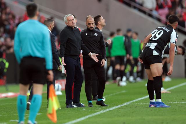 SL Benfica's Portuguese head coach Jose Mourinho gestures to the linesman during the Portuguese League football match between SL Benfica and CD Nacional da Madeira at Luz Stadium in Lisbon on April 12 , 2026. (Photo by PATRICIA DE MELO MOREIRA / AFP)