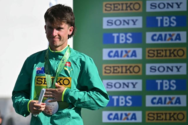 Australia's Isaac Beacroft celebrates his silver medal during the award ceremony of the World Athletics Race Walking Team Championships U20 men's 10km race, in Brasilia, on April 12, 2026. (Photo by Evaristo SA / AFP)