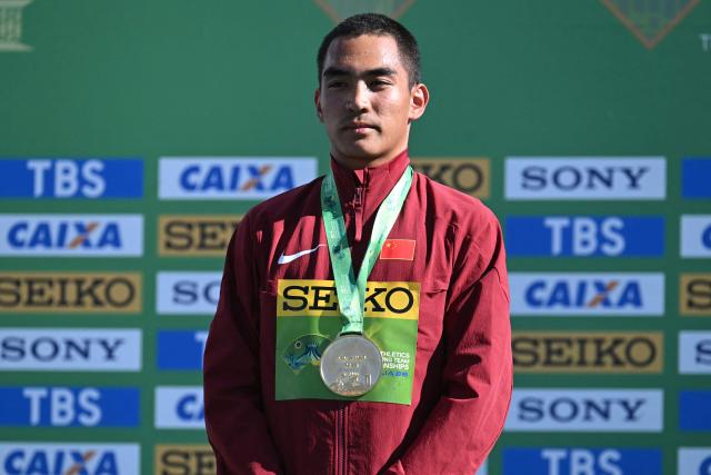 China's Pu Huajia celebrates his gold medal during the award ceremony of the World Athletics Race Walking Team Championships U20 men's 10km race, in Brasilia, on April 12, 2026. (Photo by Evaristo SA / AFP)