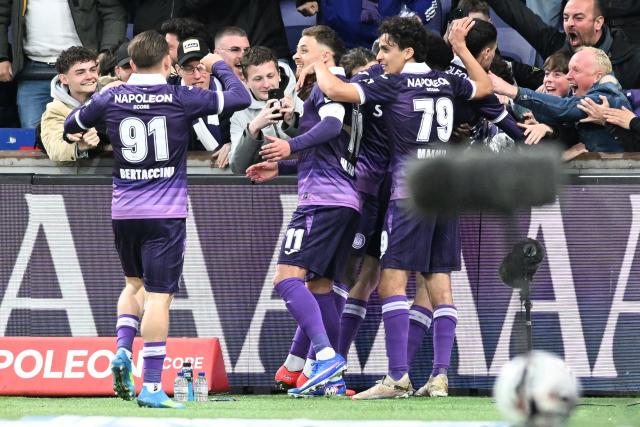 Anderlecht's Tristan Degreef (C) celebrates after scoring a goal during the Belgian Pro League football match between RSCA Anderlecht and KAA Gent at the Lotto Park in Brussels on April 12, 2026. (Photo by JILL DELSAUX / Belga / AFP) / Belgium OUT