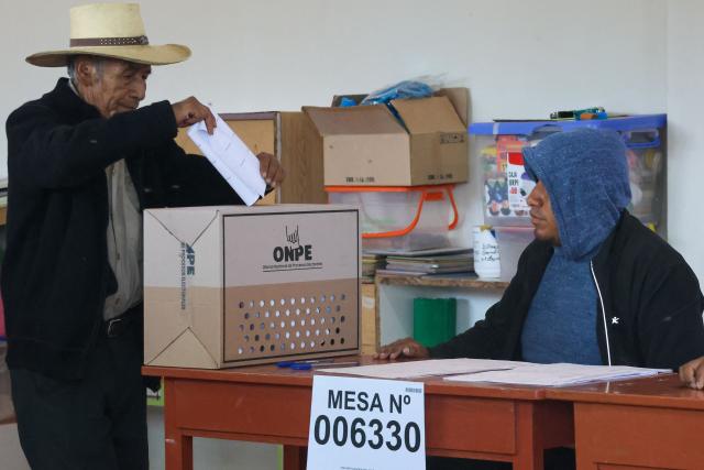 A man casts his vote in the district of Chiguata, an agricultural area located some 25 kilometres from Arequipa, Peru on April 12, 2026, during general elections. Peruvians will elect a new president from a record field of 35 candidates to lead a country plagued by organized crime and chronic political instability. (Photo by Diego RAMOS / AFP)