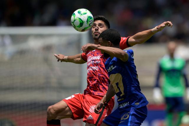 Mazatlan's forward #15 Brian Rubio (L) and Pumas' Ecuadorian midfielder #45 Pedro Vite fight for the ball during the Liga MX Clausura tournament football match between Pumas and Mazatlan at the Olimpico Universitario stadium in Mexico City, on April 12, 2026. (Photo by Alfredo ESTRELLA / AFP)