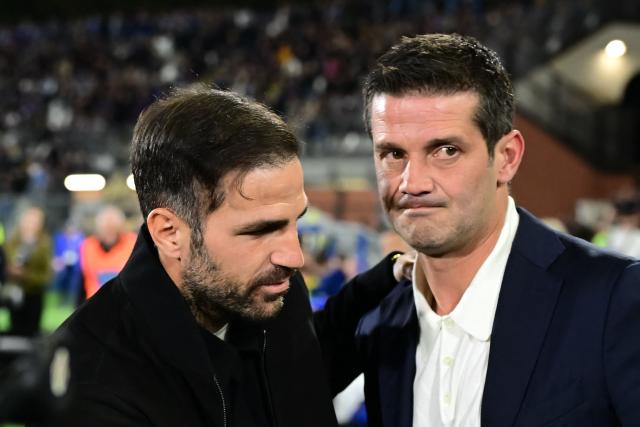 Como's Spanish coach Cesc Fabregas (L) and Inter Milan's Romanian coach Cristian Chivu (R) greet each other ahead of the Italian Serie A football match between Como and Inter Milan at the Giuseppe Sinigaglia Stadium in Como on April 12, 2026. (Photo by Piero CRUCIATTI / AFP)