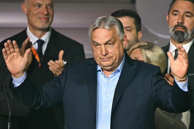 TOPSHOT - Hungarian Prime Minister Viktor Orban waves to supporters at the Balna centre in Budapest during Hungary's general election on April 12, 2026. Nationalist Viktor Orban, who has ruled Hungary for 16 years, on April 12, 2026 conceded defeat to conservative Peter Magyar in parliamentary elections. (Photo by Attila KISBENEDEK / AFP)