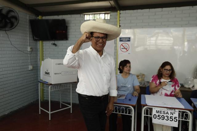 Peru's presidential candidate Roberto Sanchez of the Juntos por el Peru party gestures after voting voting at a polling station in Lima on April 12, 2026. Peruvians head to the polls to elect its ninth president in a decade, from a record field of 35 candidates, with crime-weary voters seemingly poised to extend the tide of conservative governments sweeping Latin America. (Photo by AFP)