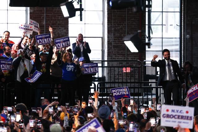 New York City Mayor Zohran Mamdani fist pumps after speaking during his 100 Day Address in Maspeth, New York on April 12, 2026. April 10 marked Mamdani's 100th day in office as New York City's 112th mayor. (Photo by CHARLY TRIBALLEAU / AFP)
