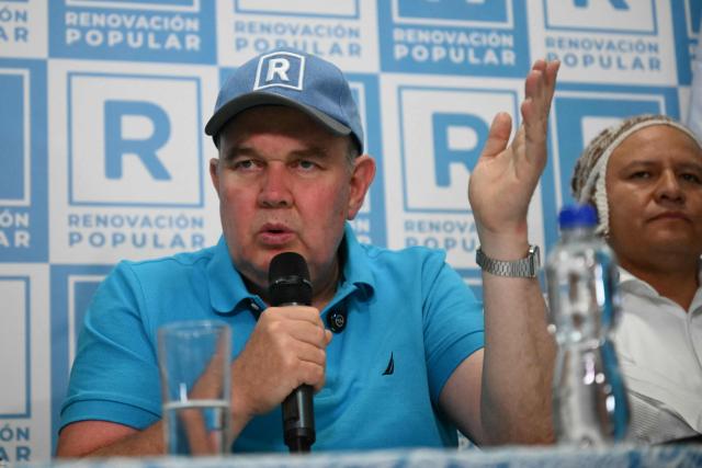 Peru’s presidential candidate for the Renovacion Popular party, Rafael Lopez Aliaga, speaks during a press conference after the polls closed in Lima on April 12, 2026. Police and prosecutors raided Peru’s electoral authority on April 12, as the country faced a deepening political crisis, after more than 63,000 voters were unable to cast their ballots in the presidential election due to the failure to deliver ballots, ballot boxes and other essential materials. (Photo by Luis ROBAYO / AFP)