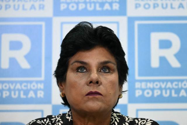 Norma Yarrow, the vice-presidential running mate of Peru’s Renovacion Popular candidate Rafael Lopez Aliaga, gestures during a press conference after the polls closed in Lima on April 12, 2026. Police and prosecutors raided Peru’s electoral authority on April 12, as the country faced a deepening political crisis, after more than 63,000 voters were unable to cast their ballots in the presidential election due to the failure to deliver ballots, ballot boxes and other essential materials. (Photo by Luis ROBAYO / AFP)
