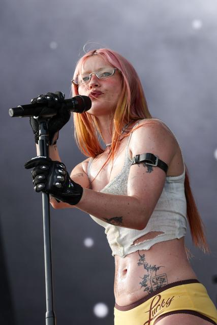 English musician Rhian Teasdale from English indie rock band Wet Leg performs on the Coachella stage during the 2026 Coachella Valley Music and Arts Festival in Indio, California on April 12, 2026. (Photo by VALERIE MACON / AFP)
