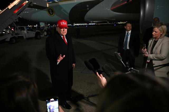 US President Donald Trump speaks to the press upon arrival at Joint Base Andrews in Maryland on April 12, 2026. Trump is returning to Washington, DC, after he attended a UFC event and spending the weekend at his Trump National Doral Miami resort. (Photo by Jim WATSON / AFP)