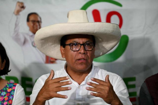 Peru's presidential candidate Roberto Sanchez of the Juntos por el Peru party, gives a speech following the first results of the presidential election in Lima on April 12, 2026. Right-wing candidate Keiko Fujimori led exit polls following Peru's troubled presidential election on April 12, 2026, but failed to avoid a runoff after a tight vote marred by irregularities and a police raid on the country's election authority. (Photo by Luis ROBAYO / AFP)