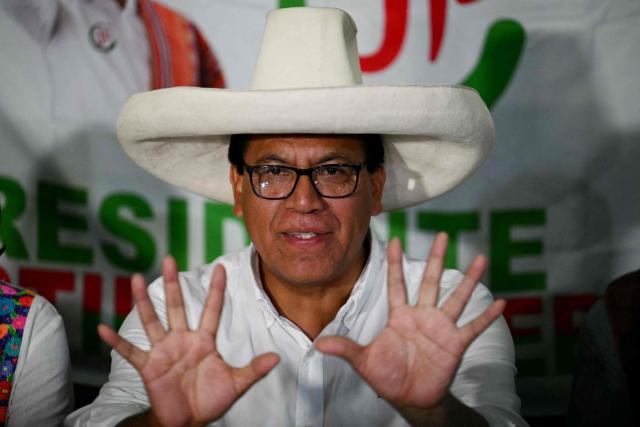 Peru's presidential candidate Roberto Sanchez of the Juntos por el Peru party, gestures as he gives a speech following the first results of the presidential election in Lima on April 12, 2026. Right-wing candidate Keiko Fujimori led exit polls following Peru's troubled presidential election on April 12, 2026, but failed to avoid a runoff after a tight vote marred by irregularities and a police raid on the country's election authority. (Photo by Luis ROBAYO / AFP)