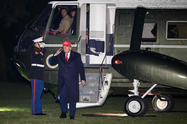 US President Donald Trump steps off Marine One on the South Lawn upon returning to the White House in Washington, DC, on April 12, 2026. Trump is returning to Washington, DC, after he attended a UFC event and spending the weekend at his Trump National Doral Miami resort. (Photo by Mandel NGAN / AFP)