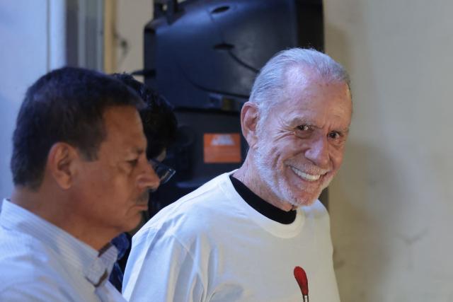 Peru’s presidential candidate Ricardo Belmont, running for the Civico Obras party, gestures at his party headquarters in Lima on April 12, 2026. Police and prosecutors raided Peru’s electoral authority on April 12, as the country faced a deepening political crisis, after more than 63,000 voters were unable to cast their ballots in the presidential election due to the failure to deliver ballots, ballot boxes and other essential materials. (Photo by Connie FRANCE / AFP)