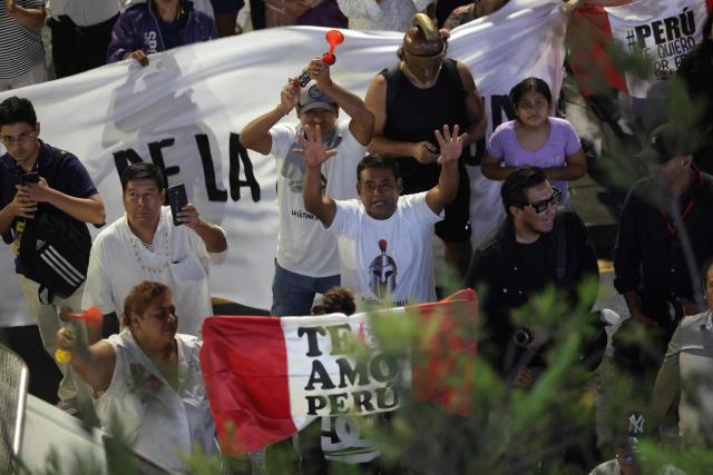 Supporters of Peruvian presidential candidate Ricardo Belmont, running for the Civico Obras party, show their support for their leader at the party headquarters in Lima on April 12, 2026. Right-wing candidate Keiko Fujimori led exit polls in Peru’s presidential election, but lacked the support needed to avoid a runoff that will determine the leader tasked with confronting the country’s deep political and security crisis. (Photo by Connie FRANCE / AFP)