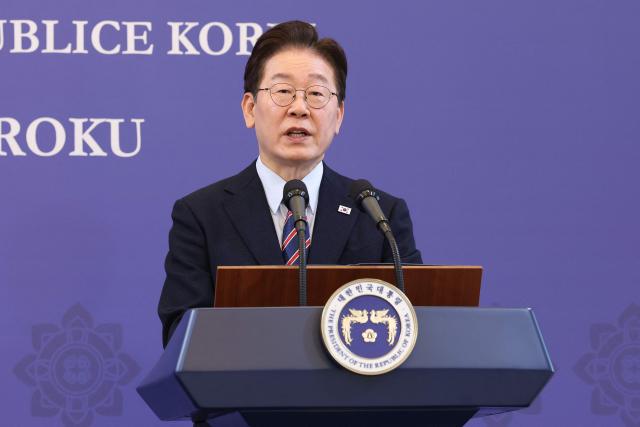 South Korean President Lee Jae Myung speaks during a joint press conference with Poland's Prime Minister Donald Tusk at the presidential Blue House in Seoul on April 13, 2026.  (Photo by Chung Sung-Jun / POOL / AFP)