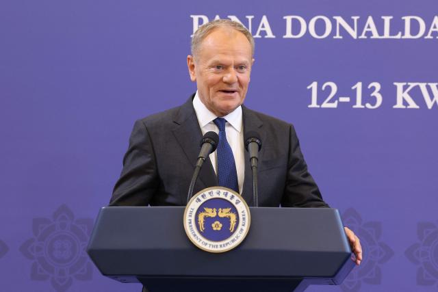 Poland's Prime Minister Donald Tusk speaks during a joint press conference with South Korean President Lee Jae Myung at the presidential Blue House in Seoul on April 13, 2026.  (Photo by Chung Sung-Jun / POOL / AFP)