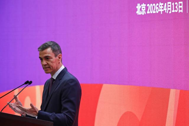 Spain's Prime Minister Pedro Sanchez delivers a speech at Tsinghua University in Beijing on April 13, 2026. Sanchez called China's trade imbalance with the European Union "unsustainable" on April 13, as he began a three-day visit to Beijing where he hopes to strengthen economic ties. (Photo by ANDRES MARTINEZ CASARES / POOL / AFP)