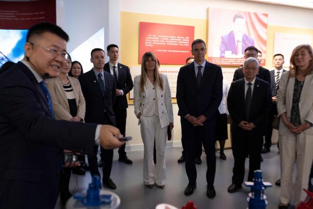 Spain's Prime Minister Pedro Sanchez (centre, R) and his wife Begona Gomez visit the University of Chinese Academy of Sciences in Beijing on April 13, 2026. Sanchez called China's trade imbalance with the European Union "unsustainable" on April 13, as he began a three-day visit to Beijing where he hopes to strengthen economic ties. (Photo by ANDRES MARTINEZ CASARES / POOL / AFP)