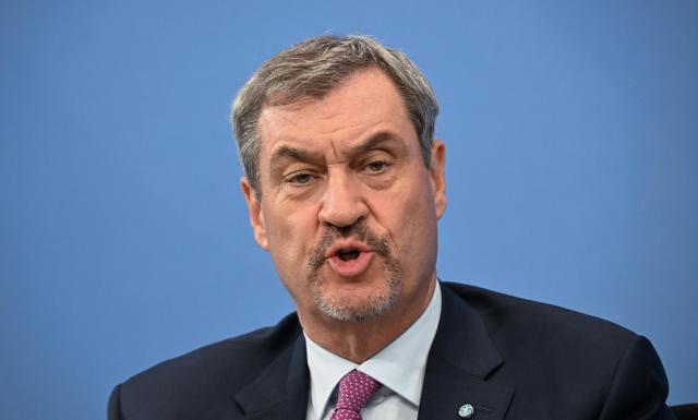 Bavaria's State Premier and leader of the conservative Christian Social Union (CSU) Markus Soeder speaks during a press briefing on the results of overnight coalition committee consultations, on April 13, 2026 at the Chancellery in Berlin. Chancellor Friedrich Merz said that Germany would cut petrol and diesel taxes for two months to provide relief to households and businesses hit by the energy shock during the Middle East war. (Photo by RALF HIRSCHBERGER / AFP)