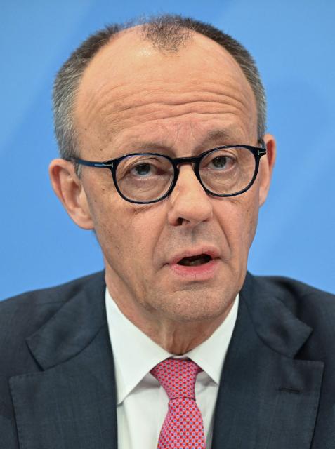 German Chancellor Friedrich Merz of the conservative Christian Democratic Union (CDU) party speaks during a press briefing on the results of overnight coalition committee consultations, on April 13, 2026 at the Chancellery in Berlin. Chancellor Friedrich Merz said that Germany would cut petrol and diesel taxes for two months to provide relief to households and businesses hit by the energy shock during the Middle East war. (Photo by RALF HIRSCHBERGER / AFP)