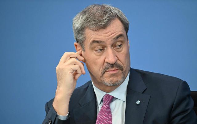 Bavaria's State Premier and leader of the conservative Christian Social Union (CSU) Markus Soeder attends a press briefing on the results of overnight coalition committee consultations, on April 13, 2026 at the Chancellery in Berlin. Chancellor Friedrich Merz said that Germany would cut petrol and diesel taxes for two months to provide relief to households and businesses hit by the energy shock during the Middle East war. (Photo by RALF HIRSCHBERGER / AFP)