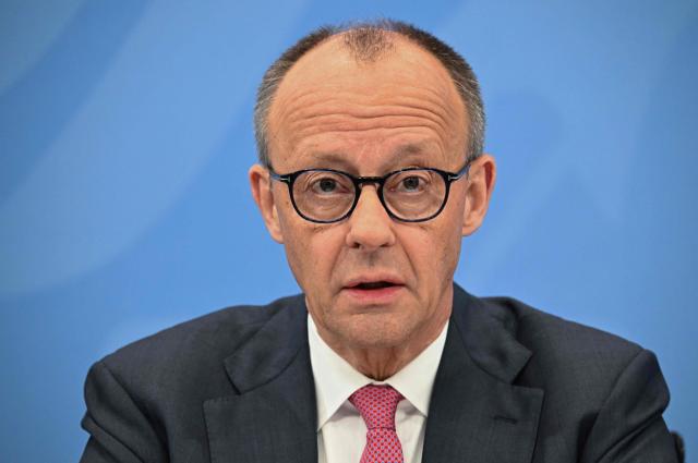 German Chancellor Friedrich Merz of the conservative Christian Democratic Union (CDU) party speaks during a press briefing on the results of overnight coalition committee consultations, on April 13, 2026 at the Chancellery in Berlin. Chancellor Friedrich Merz said that Germany would cut petrol and diesel taxes for two months to provide relief to households and businesses hit by the energy shock during the Middle East war. (Photo by RALF HIRSCHBERGER / AFP)