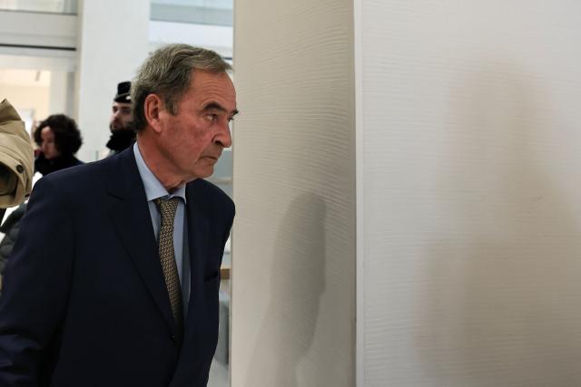 Former CEO of Lafarge Bruno Lafont arrives for verdict day of the trial of the French cement group Lafarge accused of financing terrorism in Syria, at the Paris courthouse, in Paris on April 13, 2026. The Paris criminal court will deliver its verdict against the cement company and eight former executives of the group, accused of financing terrorism for having paid jihadist groups to keep a factory running in the middle of the war in Syria. (Photo by Behrouz MEHRI / AFP)