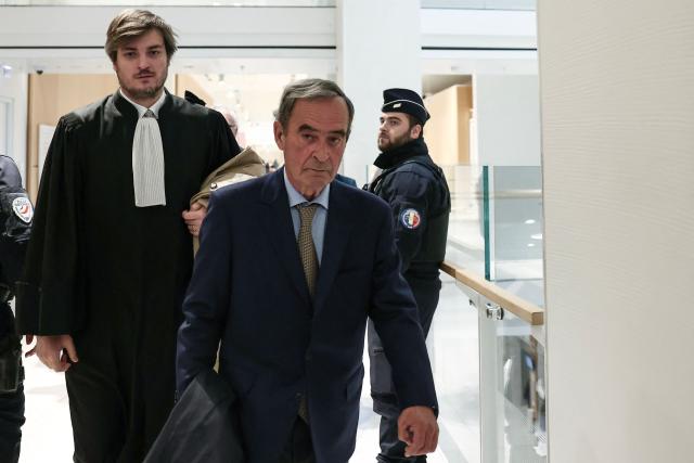 Former CEO of Lafarge Bruno Lafont arrives for veridict day of the trial of the French cement group Lafarge accused of financing terrorism in Syria, at the Paris courthouse, in Paris on April 13, 2026. The Paris criminal court will deliver its verdict against the cement company and eight former executives of the group, accused of financing terrorism for having paid jihadist groups to keep a factory running in the middle of the war in Syria. (Photo by Behrouz MEHRI / AFP)