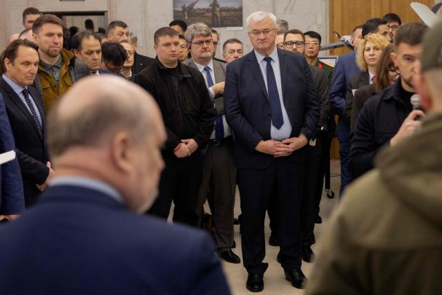 Ukraine's Foreign Minister Andrii Sybiha (C) attends the opening of the updated exhibition of defense solutions to mark Ukrainian Defence Industry Day in Kyiv, on April 13, 2026, amid the Russian invasion of Ukraine. (Photo by Tetiana DZHAFAROVA / AFP)