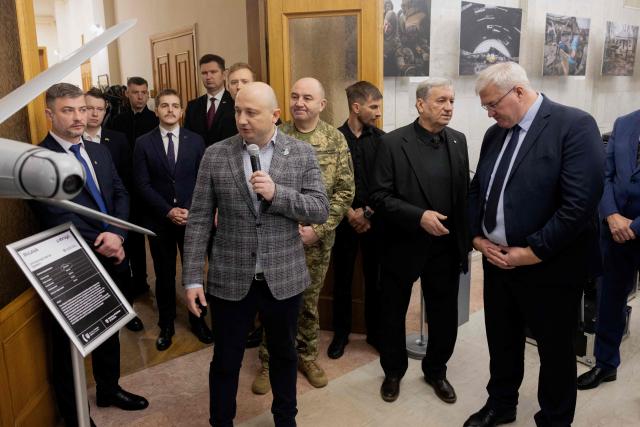 Ukraine's Foreign Minister Andrii Sybiha (R) attends the opening of the updated exhibition of defense solutions to mark Ukrainian Defence Industry Day in Kyiv, on April 13, 2026, amid the Russian invasion of Ukraine. (Photo by Tetiana DZHAFAROVA / AFP)