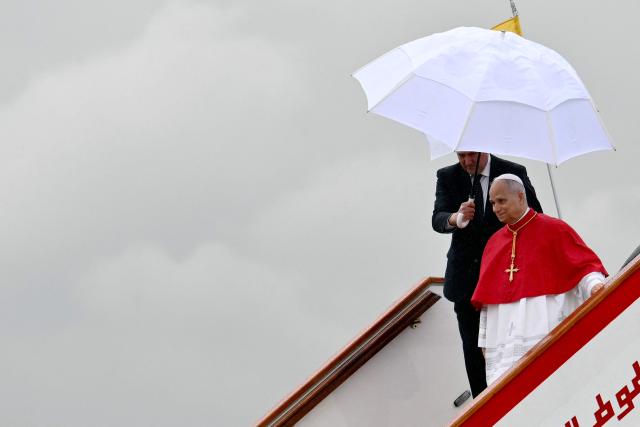 Pope Leo XIV disembarks from the plane after landing at the Houari Boumediene International Airport on April 13, 2026. Pope Leo XIV embarks today on an 11-day visit to Algeria, Cameroon, Angola and Equatorial Guinea for his first major international trip since becoming pontiff last year. (Photo by Alberto PIZZOLI / AFP)