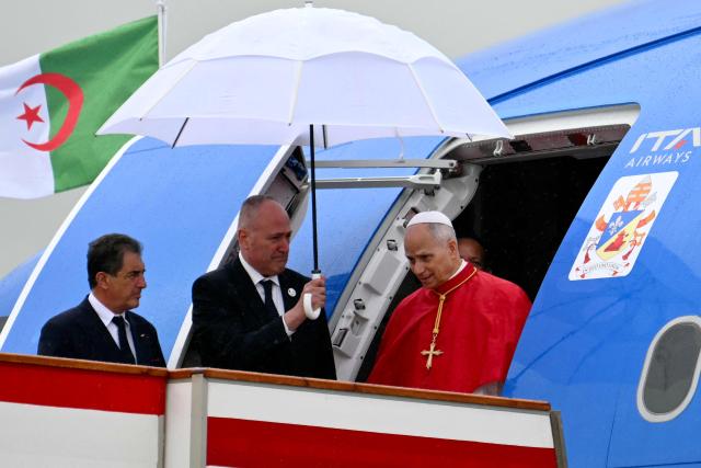 Pope Leo XIV disembarks from the plane after landing at the Houari Boumediene International Airport on April 13, 2026. Pope Leo XIV embarks today on an 11-day visit to Algeria, Cameroon, Angola and Equatorial Guinea for his first major international trip since becoming pontiff last year. (Photo by Alberto PIZZOLI / AFP)