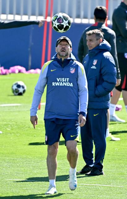 Atletico Madrid's Argentine coach Diego Simeone leads a training session on the eve of their UEFA Champions League quarter final second leg football match against FC Barcelona at the club's training ground in Majadahonda, on the outskirts of Madrid, on April 13, 2026. (Photo by Javier SORIANO / AFP)
