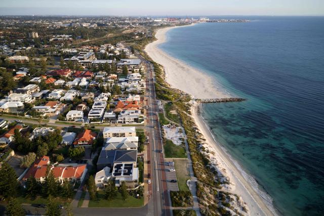 This picture taken on April 10, 2026 shows an aerial view from the affluent coastal suburb of Cottesloe in Perth, as the city’s property market sits at record highs, driven by tight housing supply and strong demand. (Photo by Antony DICKSON / AFP)