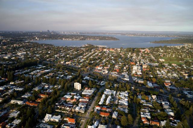 This picture taken on April 10, 2026 shows an aerial view from the affluent coastal suburb of Cottesloe in Perth, as the city’s property market sits at record highs, driven by tight housing supply and strong demand. (Photo by Antony DICKSON / AFP)