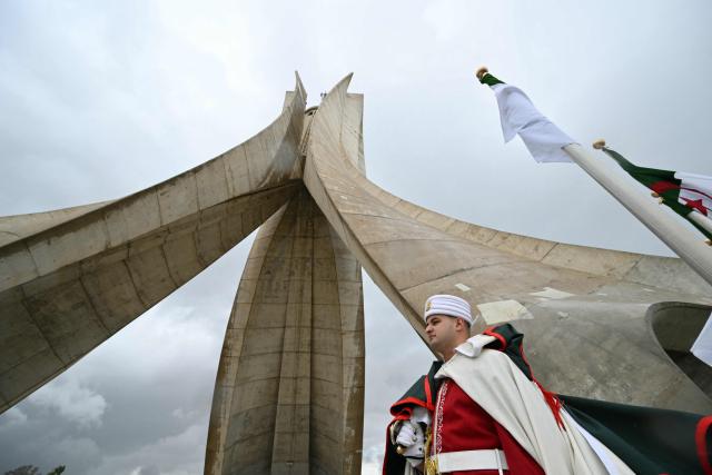 A guard stands before the arrival of Pope Leo XIV for the visit of the Maqam Echahid Martyrs’ Monument in El Madania, near Algiers on April 13, 2026. Pope Leo XIV embarks today on an 11-day visit to Algeria, Cameroon, Angola and Equatorial Guinea for his first major international trip since becoming pontiff last year. (Photo by Alberto PIZZOLI / POOL / AFP)
