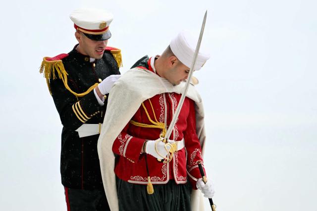 Guards get ready before the arrival of Pope Leo XIV for the visit of the Maqam Echahid Martyrs’ Monument in El Madania, near Algiers on April 13, 2026. Pope Leo XIV embarks today on an 11-day visit to Algeria, Cameroon, Angola and Equatorial Guinea for his first major international trip since becoming pontiff last year. (Photo by Alberto PIZZOLI / POOL / AFP)