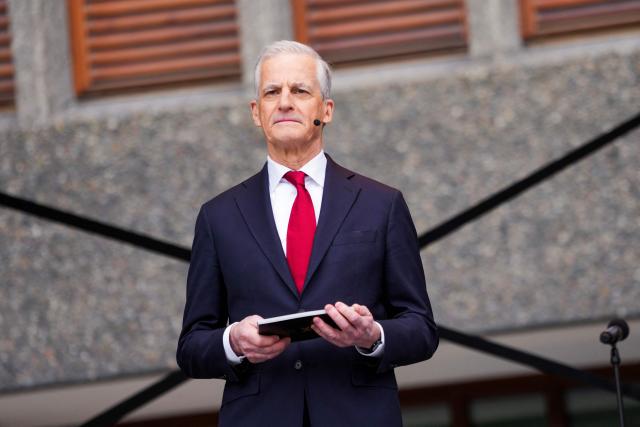 Norway's Prime Minister Jonas Gahr Store (R) speaks during the official opening of the new government quarters, on April 13, 2026 in Oslo, Norway. Almost 15 years after the terrorist attack on July 22, 2011, the first 2,200 employees are moving into brand new premises at Hammersborg in Oslo. April 13, 2026 marks the official opening of the first of three construction phases in the new government quarter. (Photo by Ole Berg-Rusten / NTB / AFP) / Norway OUT