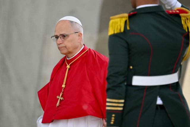 Pope Leo XIV visits the Maqam Echahid Martyrs’ Monument in El Madania, near Algiers on April 13, 2026. Pope Leo XIV embarks today on an 11-day visit to Algeria, Cameroon, Angola and Equatorial Guinea for his first major international trip since becoming pontiff last year. (Photo by Alberto PIZZOLI / POOL / AFP)