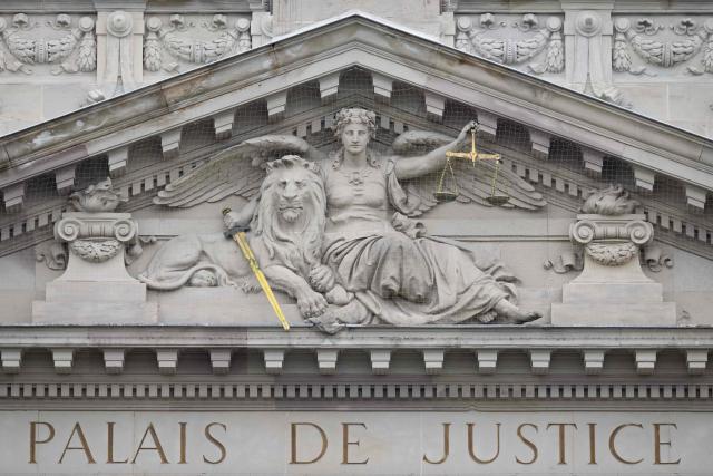 This photograph shows a pedimental sculpture of Lady Justice with a lion on the facade of the Strasbourg courthouse on April 13, 2026. (Photo by SEBASTIEN BOZON / AFP)