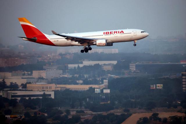 (FILES) A Spain's Iberia's Airbus A330-202 airplane lands at the Madrid-Barajas Adolfo Suarez Airport in Madrid, on June 12, 2025. Spanish airline Iberia on April 13, 2026 said it will suspend its Cuba flights from June to late October "due to the situation" on the communist-run Caribbean island, which is under a de facto US fuel blockade. (Photo by Thomas COEX / AFP)