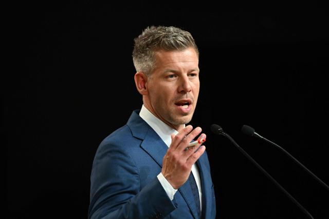 Peter Magyar, election winner and leader of the pro-European conservative TISZA party, delivers a press conference at the HUNGEXPO Congress and Exhibition Center in Budapest, Hungary, on April 13, 2026, one day after Hungarian general elections. The party of conservative Peter Magyar won a two-thirds parliamentary majority in Hungarian elections in a clear defeat for nationalist long-time Prime Minister Viktor Orban, according to near-complete results. (Photo by Attila KISBENEDEK / AFP)