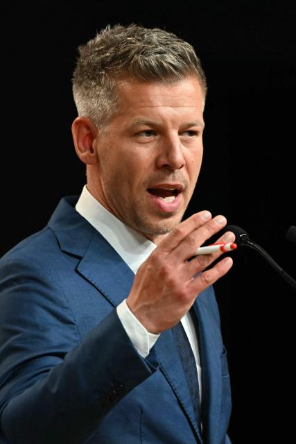 Peter Magyar, election winner and leader of the pro-European conservative TISZA party, delivers a press conference at the HUNGEXPO Congress and Exhibition Center in Budapest, Hungary, on April 13, 2026, one day after Hungarian general elections. The party of conservative Peter Magyar won a two-thirds parliamentary majority in Hungarian elections in a clear defeat for nationalist long-time Prime Minister Viktor Orban, according to near-complete results. (Photo by Attila KISBENEDEK / AFP)