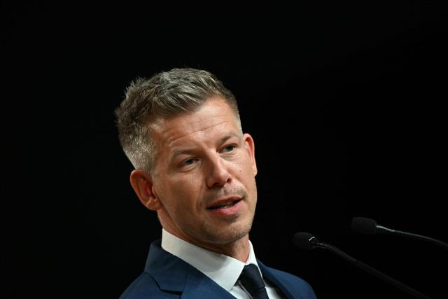 Peter Magyar, election winner and leader of the pro-European conservative TISZA party, delivers a press conference at the HUNGEXPO Congress and Exhibition Center in Budapest, Hungary, on April 13, 2026, one day after Hungarian general elections. The party of conservative Peter Magyar won a two-thirds parliamentary majority in Hungarian elections in a clear defeat for nationalist long-time Prime Minister Viktor Orban, according to near-complete results. (Photo by Attila KISBENEDEK / AFP)
