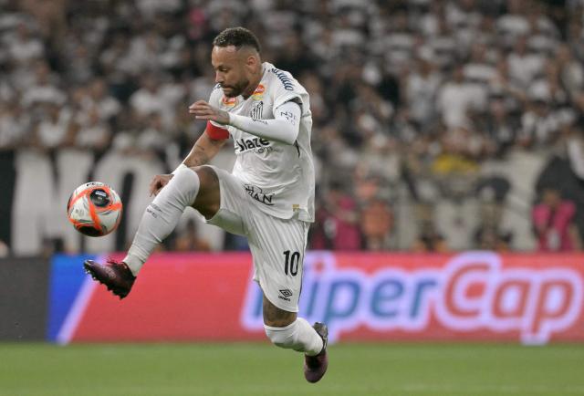 (FILES) Santos' forward #10 Neymar controls the ball during the Campeonato Paulista A1 football match between Corinthians and Santos at Arena Corinthians in Sao Paulo on February 12, 2025. Lights, cameras and the ball: Neymar is finally set to walk the red carpet at the 2026 Copa Sudamericana in a debut that has all eyes on Brazil. Santos will face Recoleta of Paraguay on April 14, 2026, in a great opportunity for the 34-year-old star to win over Carlo Ancelotti. (Photo by NELSON ALMEIDA / AFP)