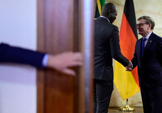 German Foreign Minister Johann Wadephul (R) shakes hands with his South African counterpart Ronald Ozzy Lamola during a visit at the Foreign Office in Berlin on April 13, 2026. (Photo by Tobias SCHWARZ / AFP)
