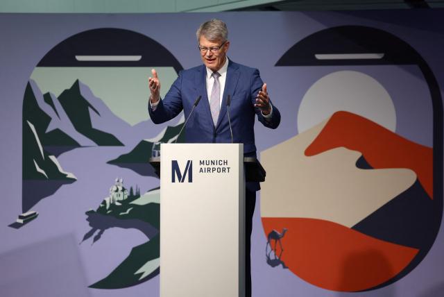 German Transport Minister Patrick Schnieder addresses a press conference on the official opening of the new Terminal 1 pier at Munich International Airport, southern Germany on April 13, 2026. The Terminal 1 Pier provides additional capacity for up to six million passengers per year. The new building is currently one of Bavaria’s largest infrastructure projects. (Photo by Alexandra BEIER / AFP)