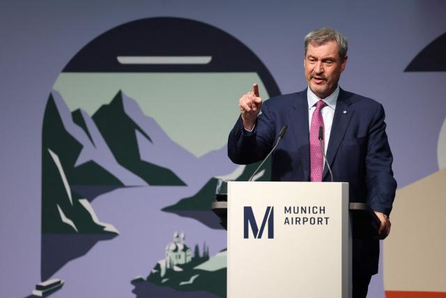 Bavaria's State Premier Markus Soeder addresses a press conference on the official opening of the new Terminal 1 pier at Munich International Airport, southern Germany on April 13, 2026. The Terminal 1 Pier provides additional capacity for up to six million passengers per year. The new building is currently one of Bavaria’s largest infrastructure projects. (Photo by Alexandra BEIER / AFP)